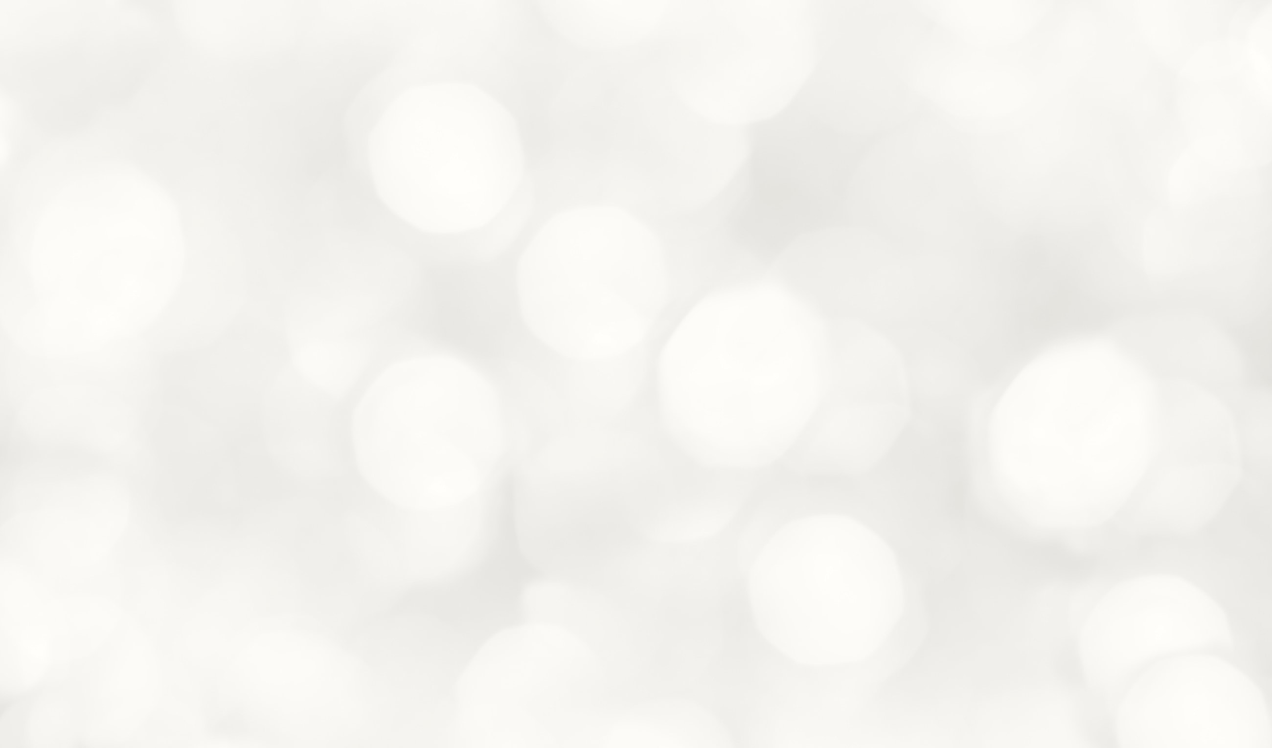 Soft white bokeh background texture.