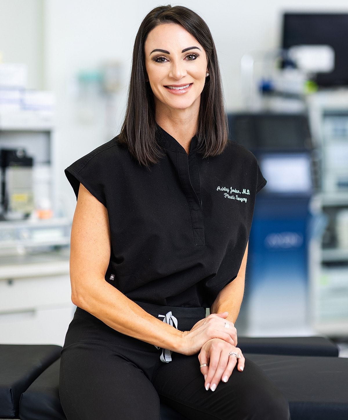 Female plastic surgeon in clinic setting.
