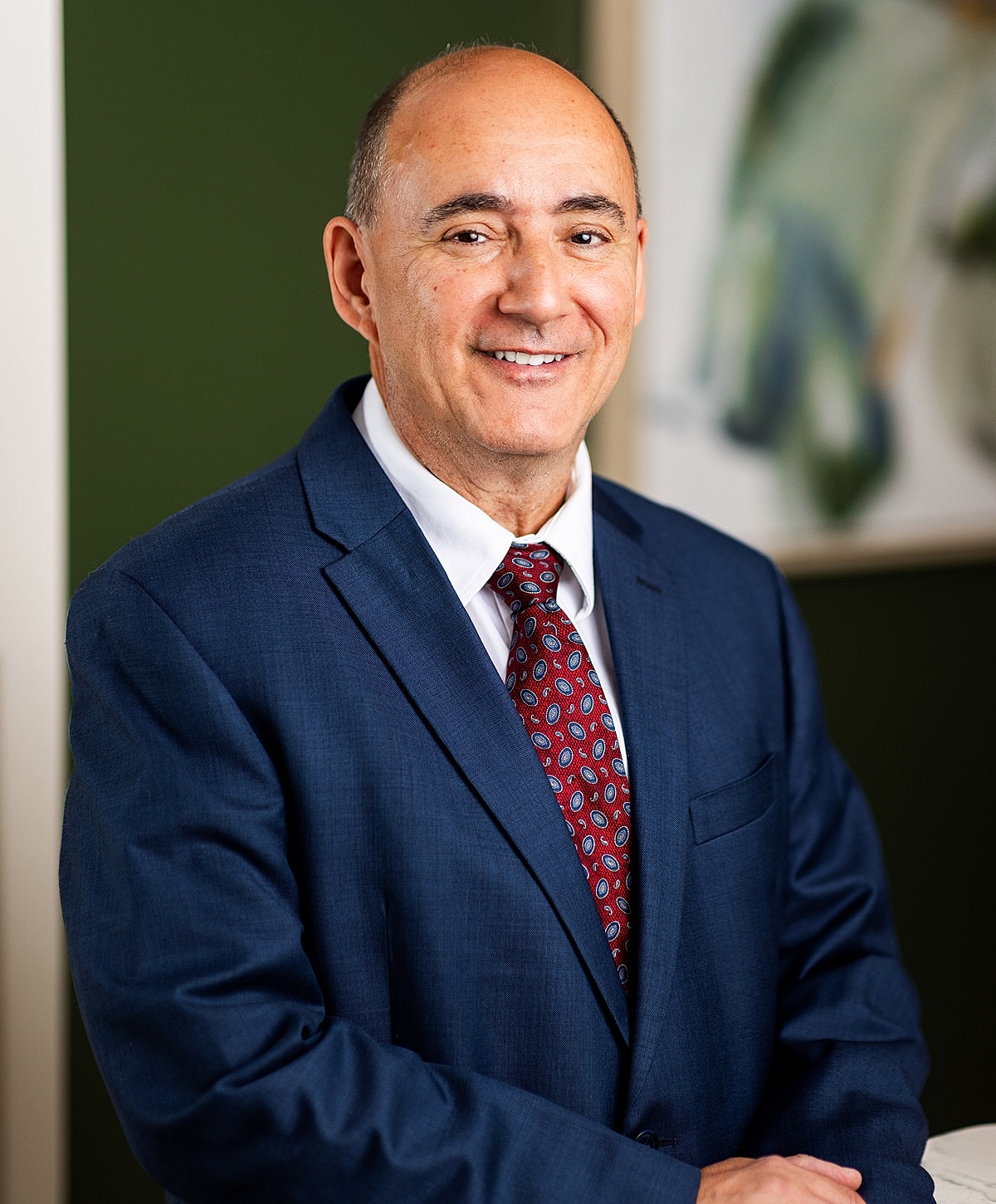 Man in a suit smiling professionally