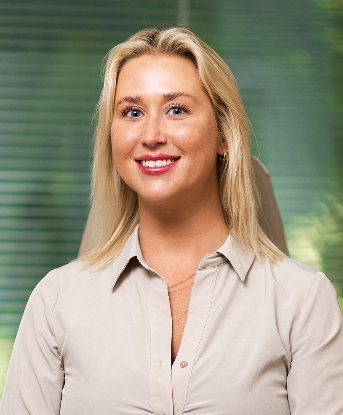 Smiling woman in a professional setting.