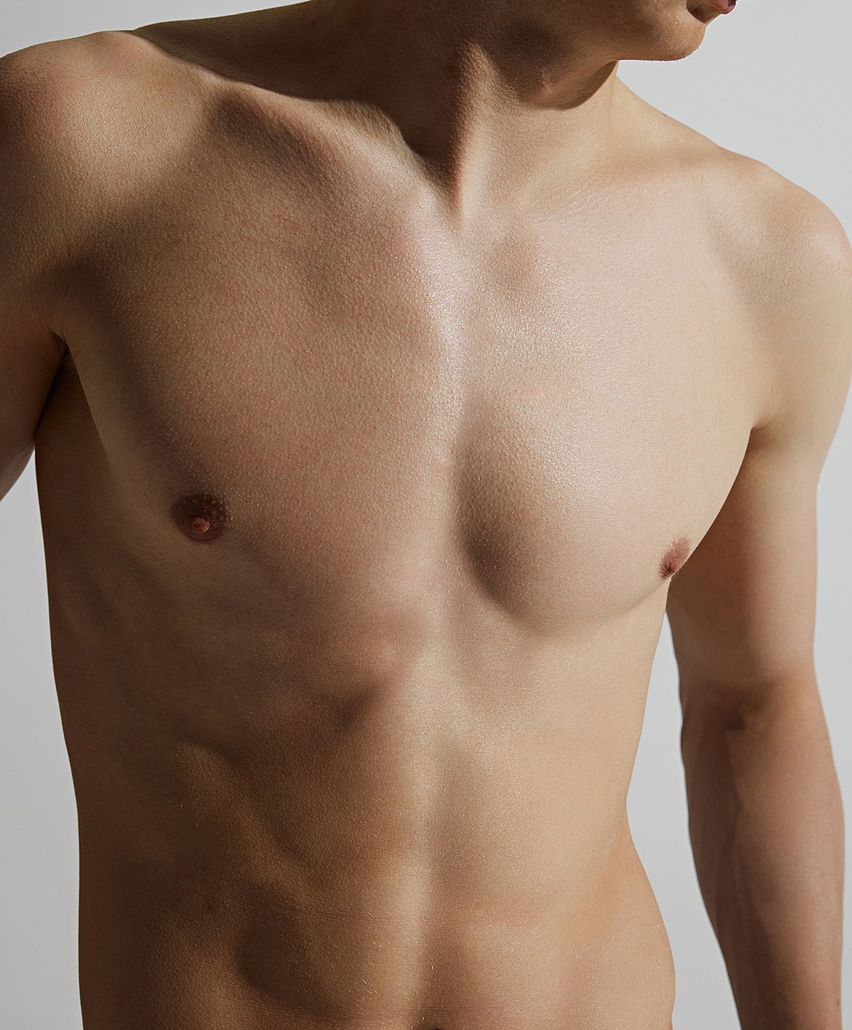 Male torso with skin tone and light shadows.