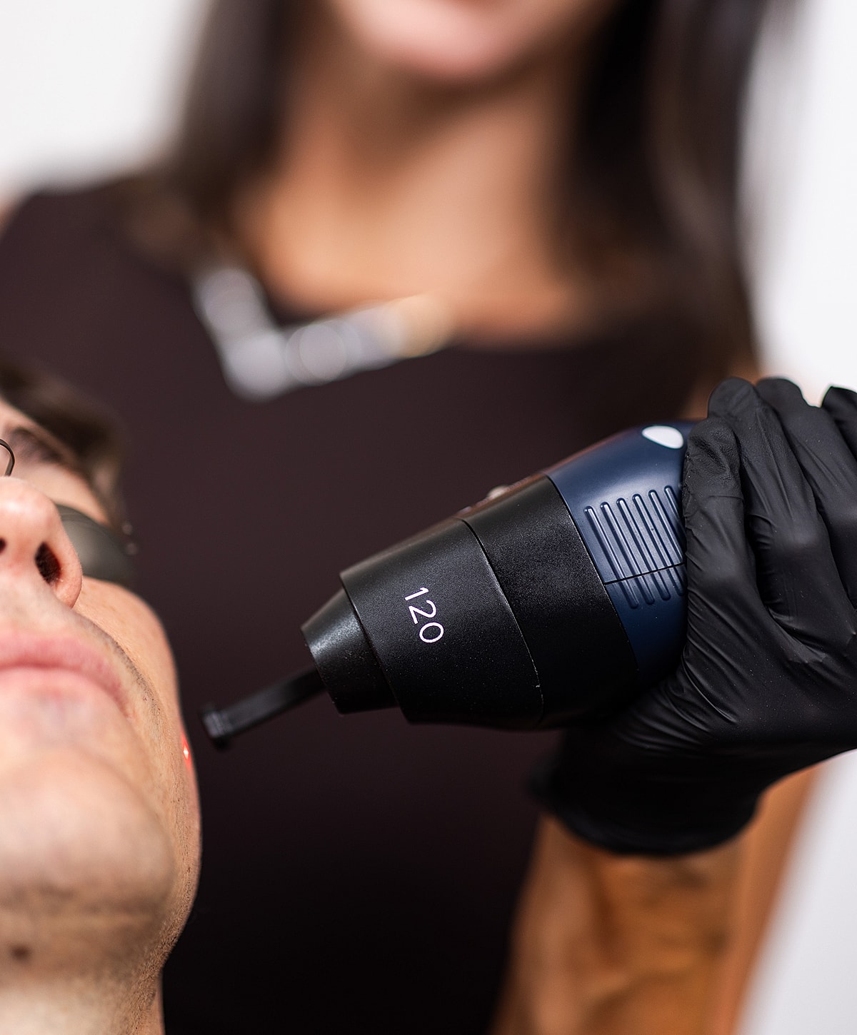 Facial treatment with a handheld device.
