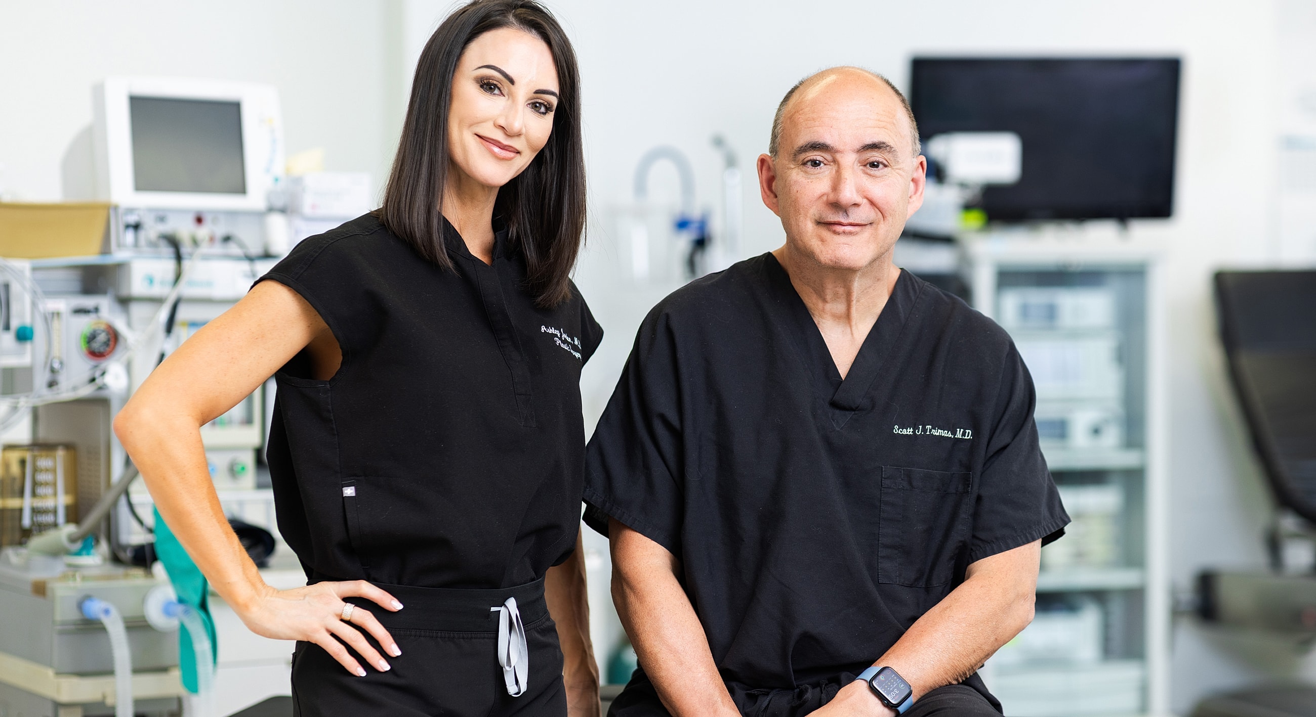 Medical professionals posing in a clinical setting.