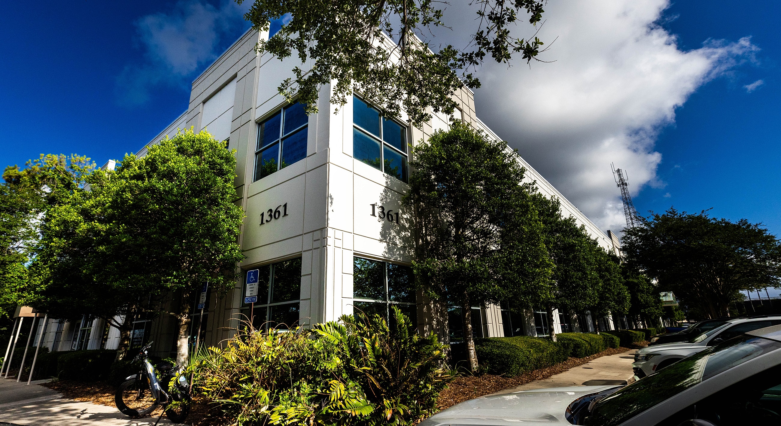 Modern building exterior with green landscaping.