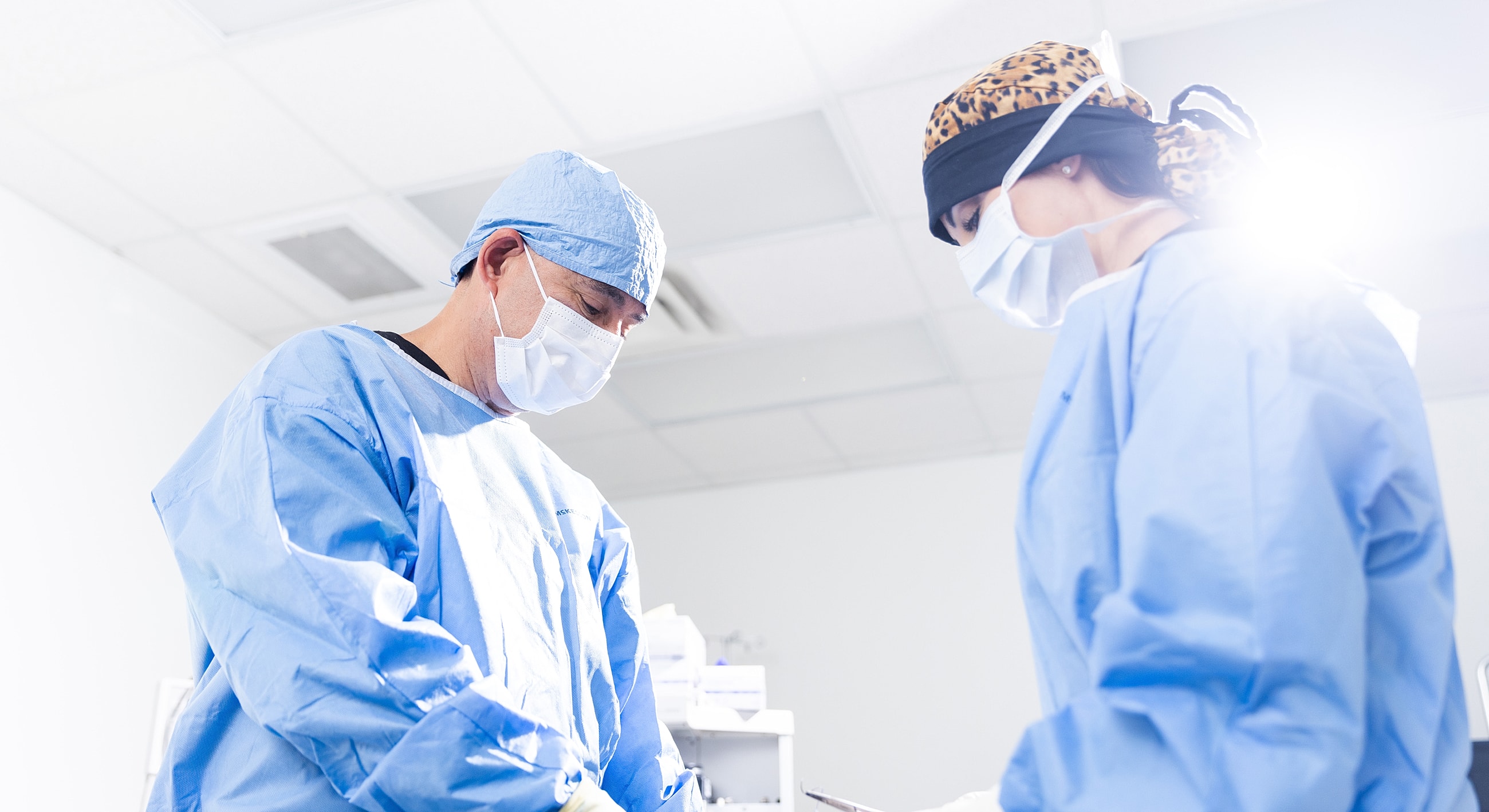 Surgeons collaborating in a medical procedure.