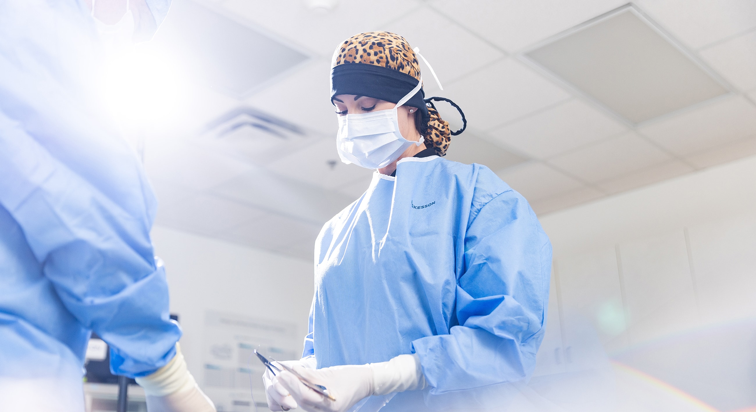 Surgeon preparing for a medical procedure in scrubs.